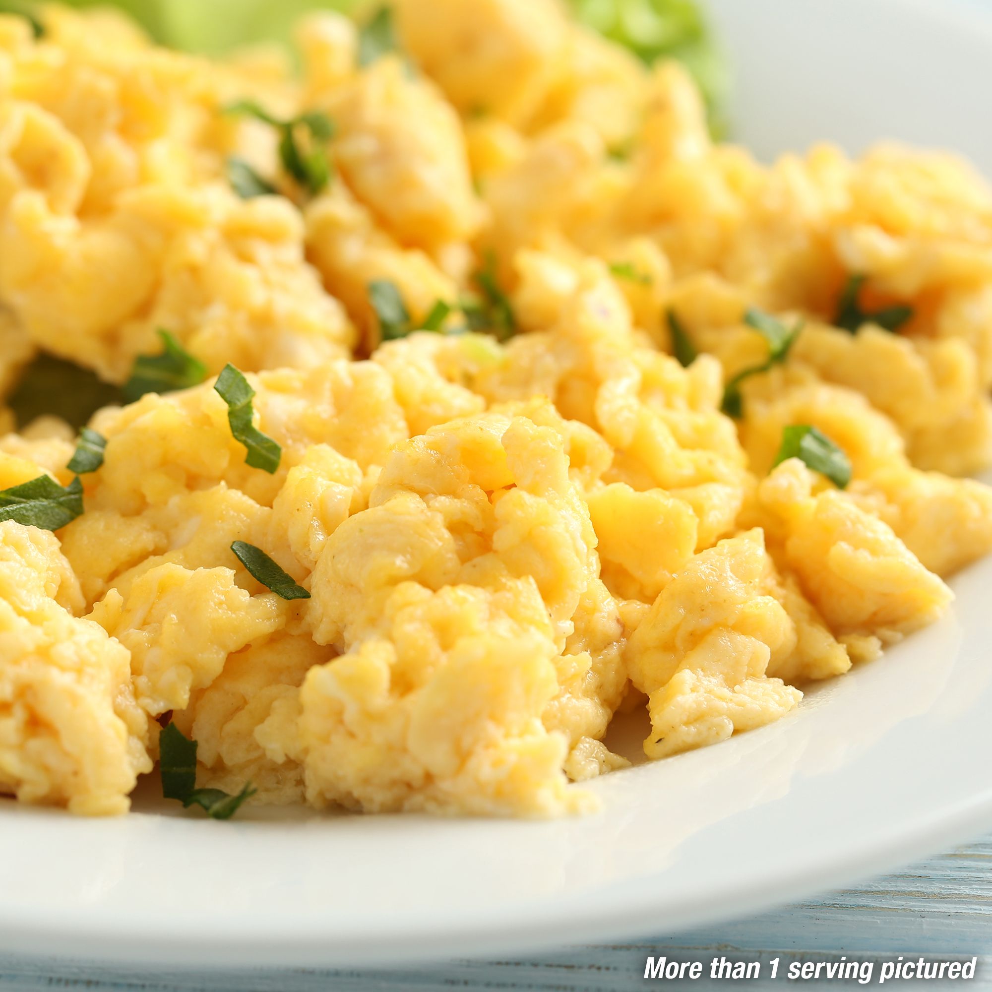 A mother fills her daughter's plate with creamed corn for Christmas dinner.