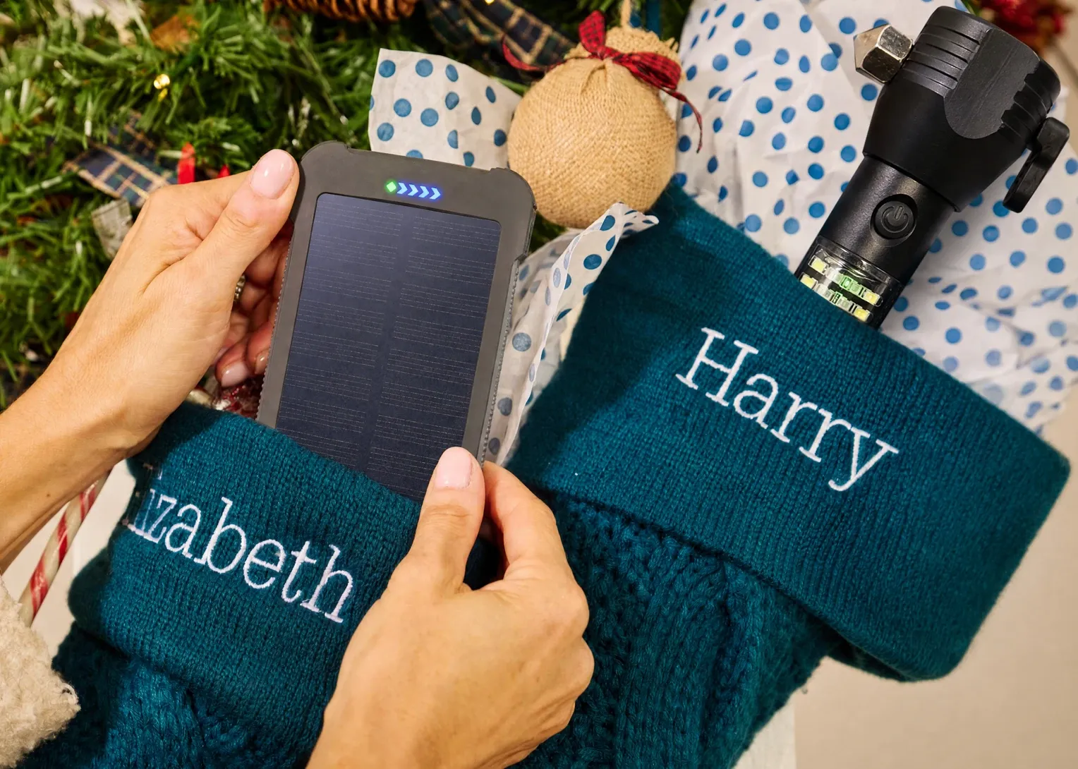 A Patriot Power Cell Power Bank and HaloXT Tactical Flashlight in Christmas stockings