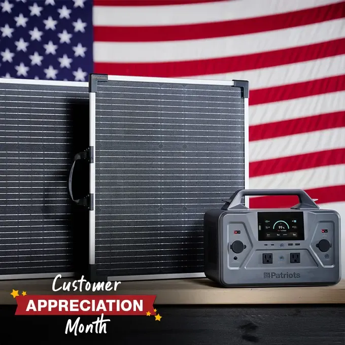 Patriot Power Solar Generator 1200 with 2 solar panels in front of an American Flag