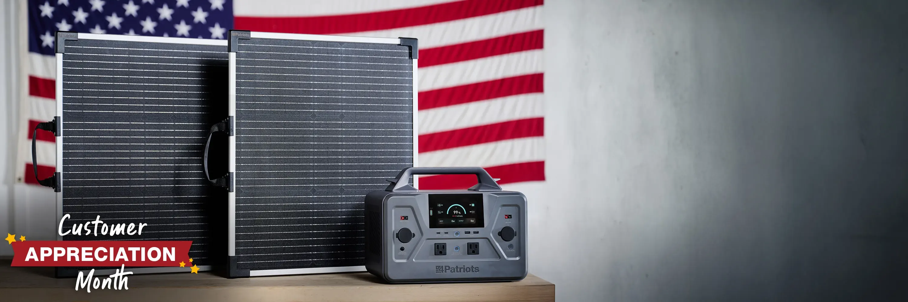 A Patriot Power Solar Generator 1200 sitting on a table with 2 solar panels in from of an American flag in honor of customer appreciation month