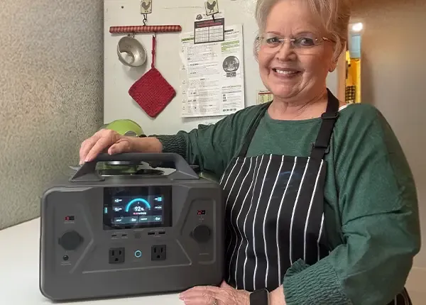 A female customer with the 4Patriots Patriot Power Generator 1200 in her kitchen.