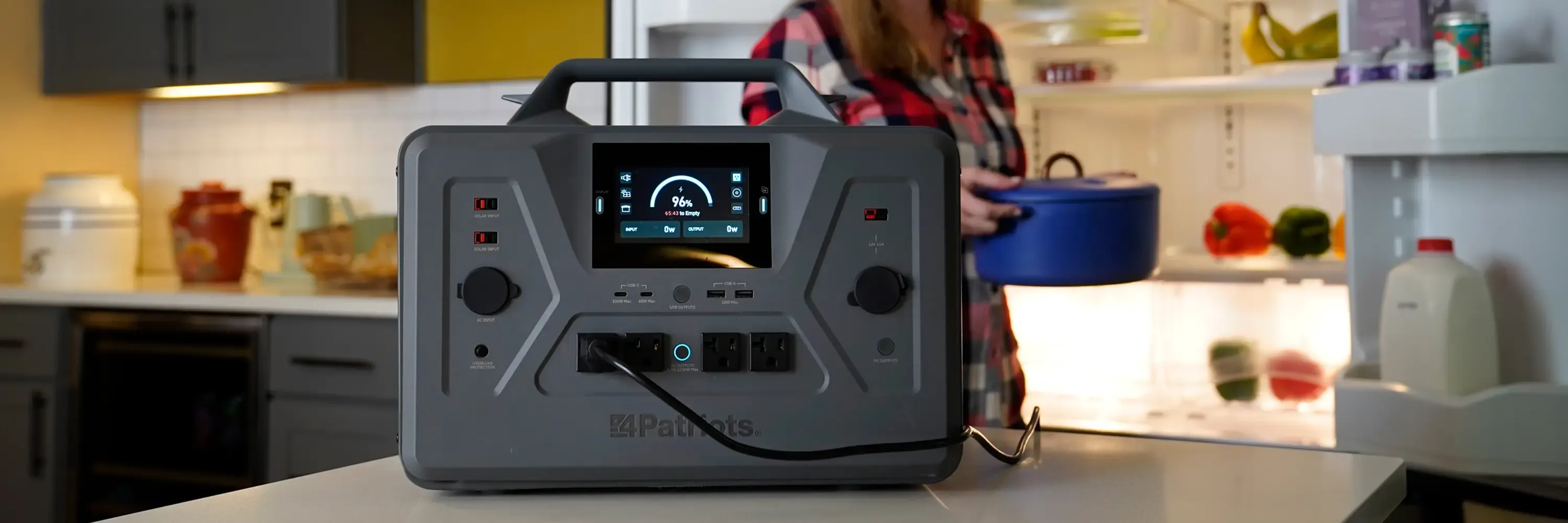 Patriot Power Solar Generator 2500X powers fridge Person unfolding a large 200-watt solar panel outdoors next to a 4Patriots Patriot Power Generator 2200X on a wooden deck.