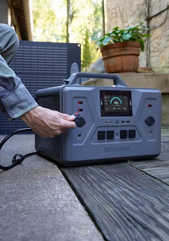 camper with his dog and a 4Patriots generator