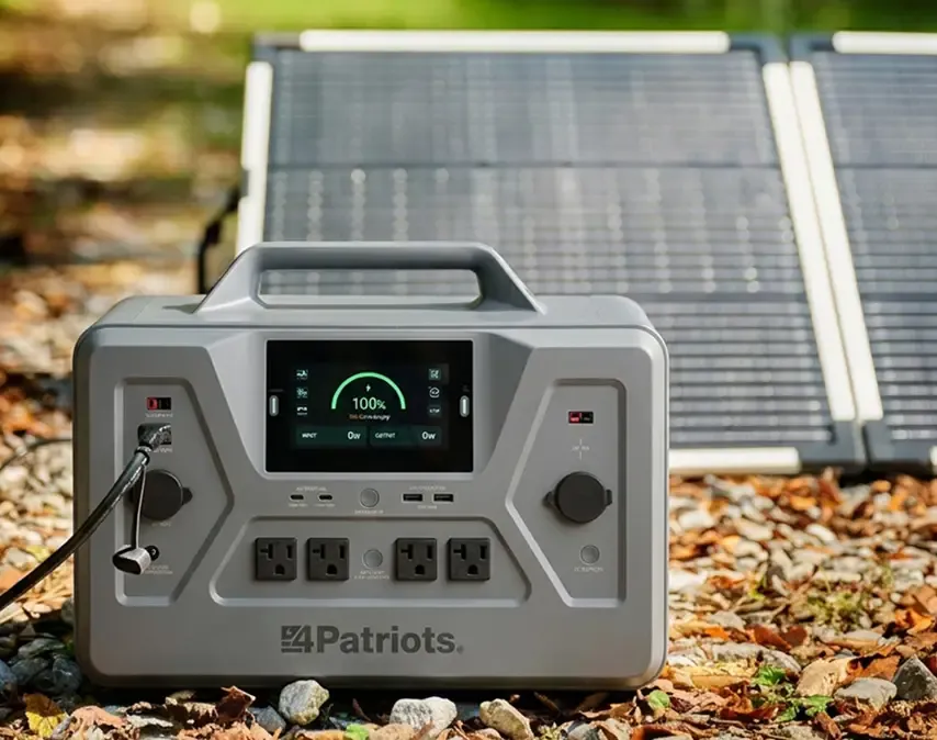 A Solar Generator 2200X sitting outside in the sun charging with its solar panel. 