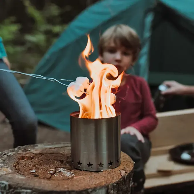 Cooking marshmallows over the StarFire Camp Stove at a campsite
