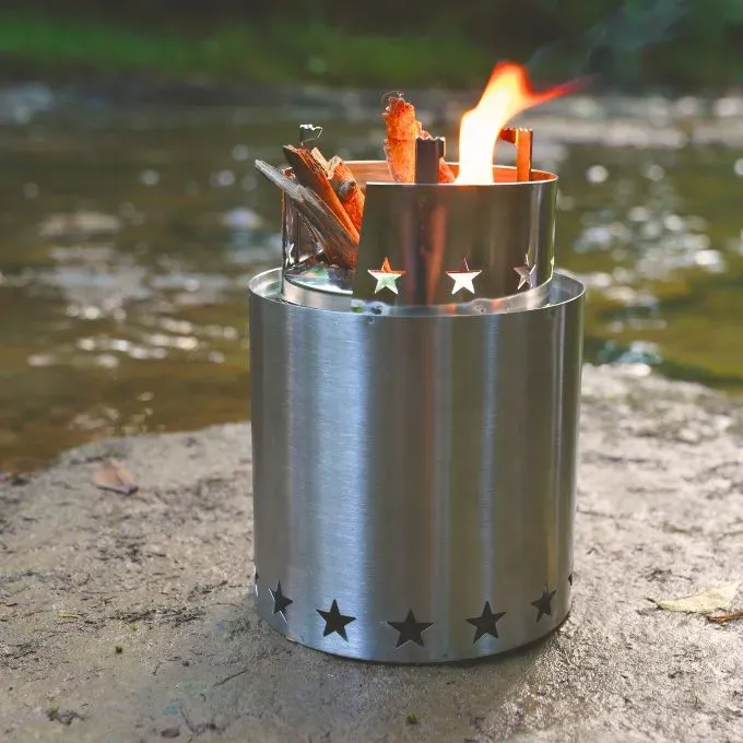 StarFire Camp Stove A StarFire Camp Stove burning small twigs by a creek
